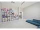 Spacious bonus room featuring a modular couch and custom shelving at 4137 W Cielo Grande --, Glendale, AZ 85310