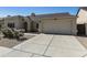 Exterior view of a single-story home with a two-car garage and desert landscaping at 4137 W Cielo Grande --, Glendale, AZ 85310