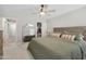Bright main bedroom featuring a comfortable full bed, walk-in closet and ceiling fan at 4137 W Cielo Grande --, Glendale, AZ 85310