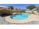 Backyard oasis featuring a sparkling pool, spa, and patio area, perfect for outdoor entertaining at 4137 W Cielo Grande --, Glendale, AZ 85310