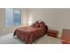 Warm bedroom featuring a queen-size bed with decorative bedding at 41584 W Springtime Rd, Maricopa, AZ 85138