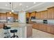 Spacious kitchen features granite counters, an island with seating, stainless steel appliances, and lots of cabinet space at 41584 W Springtime Rd, Maricopa, AZ 85138