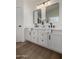 Modern bathroom with a double vanity, stylish mirrors, and neutral decor at 42067 W Anne Ln, Maricopa, AZ 85138