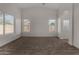 Spacious bedroom with carpet and natural light streaming through the windows at 42067 W Anne Ln, Maricopa, AZ 85138