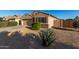 Well-maintained single-story home with desert landscaping and a private fenced yard at 42067 W Anne Ln, Maricopa, AZ 85138