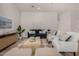 Bright living room featuring modern furnishings, stylish decor, and a cozy atmosphere at 42067 W Anne Ln, Maricopa, AZ 85138