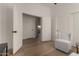 A versatile office space with light wood flooring and neutral walls provides a calm, productive environment at 42067 W Anne Ln, Maricopa, AZ 85138