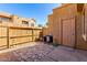 Private backyard area with stone pavers and wooden fence at 4601 N 102Nd Ave # 1116, Phoenix, AZ 85037