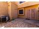 Private backyard area with stone pavers and two doors at 4601 N 102Nd Ave # 1116, Phoenix, AZ 85037