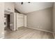 Bedroom showcasing wood flooring, vaulted ceilings, walk-in closet, and neutral paint at 4601 N 102Nd Ave # 1116, Phoenix, AZ 85037