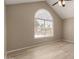 Bright bedroom with laminate floors, and vaulted ceiling. Large window provides natural light at 4601 N 102Nd Ave # 1116, Phoenix, AZ 85037