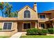 Charming two-story townhouse featuring a tile roof, an arched window, decorative trim, and a well-maintained facade at 4601 N 102Nd Ave # 1116, Phoenix, AZ 85037