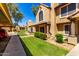 Charming condo featuring well-kept lawns, desert landscaping, assigned parking, and a unique barrel tile roof at 4601 N 102Nd Ave # 1116, Phoenix, AZ 85037
