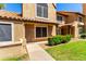 Inviting two-story home featuring a well-maintained lawn and desert-friendly landscaping, exuding charm at 4601 N 102Nd Ave # 1116, Phoenix, AZ 85037