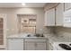 Updated kitchen featuring granite countertops, undermount sink, and stainless steel faucet at 4601 N 102Nd Ave # 1116, Phoenix, AZ 85037