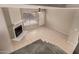 Spacious living room showcasing fireplace, ceiling fan, neutral paint and tile floors at 4601 N 102Nd Ave # 1116, Phoenix, AZ 85037