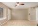 Inviting living room featuring neutral tile floors, a bright window, and an entry door, a great space at 4601 N 102Nd Ave # 1116, Phoenix, AZ 85037