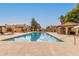 A refreshing community pool surrounded by lounge areas and classic desert architecture at 4601 N 102Nd Ave # 1116, Phoenix, AZ 85037
