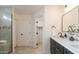 Bright bathroom featuring dual sinks, stylish fixtures, and modern shower with mosaic tile accents at 4855 E Gary St, Mesa, AZ 85205