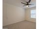 Bright bedroom with neutral walls, ceiling fan, and a window to let in natural light at 4855 E Gary St, Mesa, AZ 85205