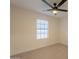 Cozy bedroom with ceiling fan and a large window providing natural lighting at 4855 E Gary St, Mesa, AZ 85205