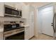 Updated kitchen with modern stainless appliances and light cabinets at 4855 E Gary St, Mesa, AZ 85205
