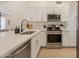 Bright kitchen featuring stainless appliances, stone countertops, and sleek fixtures at 4855 E Gary St, Mesa, AZ 85205