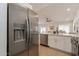 Bright open concept kitchen with stainless appliances and filtered water dispenser at 4855 E Gary St, Mesa, AZ 85205