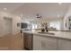 Bright living room flowing to kitchen and dining area, perfect for entertaining at 4855 E Gary St, Mesa, AZ 85205