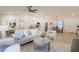 Open-concept living space with light wood floors, neutral decor, and plenty of natural light at 4855 E Gary St, Mesa, AZ 85205