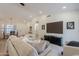 Open-concept living space with light wood floors, neutral decor, and plenty of natural light at 4855 E Gary St, Mesa, AZ 85205