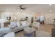 Open-concept living space with light wood floors, neutral decor, and plenty of natural light at 4855 E Gary St, Mesa, AZ 85205