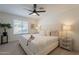 Tranquil main bedroom with plush carpeting, a ceiling fan, and natural light from a window with blinds at 4855 E Gary St, Mesa, AZ 85205