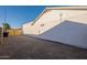Home's side yard features a long driveway and gate access to the backyard at 4855 E Gary St, Mesa, AZ 85205