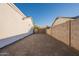 Home's side yard features gravel landscaping and block wall fencing at 4855 E Gary St, Mesa, AZ 85205