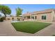 Beautiful backyard featuring a pool, lush landscaping, and a well-manicured lawn for relaxation and entertainment at 4960 E Dale Ln, Cave Creek, AZ 85331