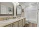 Well-lit bathroom with double sinks, granite countertops, and decorative mirrors, complemented by modern fixtures at 4960 E Dale Ln, Cave Creek, AZ 85331