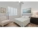 Bright bedroom featuring a neutral color scheme, plantation shutters, and comfortable furniture at 4960 E Dale Ln, Cave Creek, AZ 85331