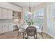 A charming breakfast nook has a built-in desk and shelving with shuttered windows at 4960 E Dale Ln, Cave Creek, AZ 85331