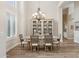A formal dining room features a decorative chandelier, dining table, and a cabinet for storage at 4960 E Dale Ln, Cave Creek, AZ 85331