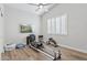 Home gym with natural light, hardwood floors, vaulted ceilings, and modern exercise equipment at 4960 E Dale Ln, Cave Creek, AZ 85331