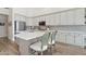 An open kitchen showcases a center island with bar stool seating and modern appliances at 4960 E Dale Ln, Cave Creek, AZ 85331