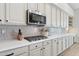 Close up of the stovetop in the kitchen with light cabinetry at 4960 E Dale Ln, Cave Creek, AZ 85331