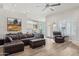 Spacious living room with modern furnishings, wood floors, and backyard access at 4960 E Dale Ln, Cave Creek, AZ 85331