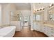 A luxurious main bathroom has a soaking tub, glass shower, and dual vanities at 4960 E Dale Ln, Cave Creek, AZ 85331