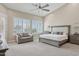 A spacious main bedroom features plush carpeting, a ceiling fan, and shuttered windows at 4960 E Dale Ln, Cave Creek, AZ 85331