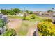 Spacious backyard featuring a community pool surrounded by well-maintained lawns and lush landscaping at 5209 N 78Th St, Scottsdale, AZ 85250
