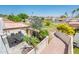 Backyard view featuring a covered patio, vibrant landscaping, and well-maintained lawn perfect for outdoor living at 5209 N 78Th St, Scottsdale, AZ 85250