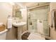 Bathroom featuring pedestal sink, glass enclosed shower with grab bar and tiled floor at 5209 N 78Th St, Scottsdale, AZ 85250