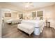 Bright bedroom with shuttered window, mirrored closet and stylish bench at the foot of the bed at 5209 N 78Th St, Scottsdale, AZ 85250